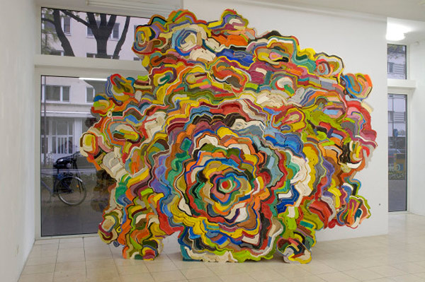 artist uses recycled books to create large sculpture